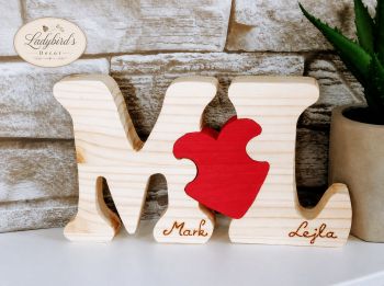 Celebrate your love with this beautiful, handmade 3-piece wooden monogram puzzle. Featuring custom wood-burned names, initials, and a vibrant red heart puzzle piece, it is a truly unique gift and a timeless decoration for your home.
⚠️ SAFETY NOTICE: This product is designed as a home decor item only. It is NOT a toy and is NOT suitable for children to play with.
