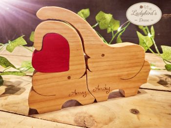 Celebrate your bond with this beautiful, handmade wooden elephant couple puzzle. Featuring custom wood-burned names and an interlocking red heart piece, this freestanding ornament is a heartwarming anniversary, wedding, or Valentine's Day gift.
⚠️ SAFETY NOTICE: This product is designed as a home decor item only. It is NOT a toy and is NOT suitable for children to play with.