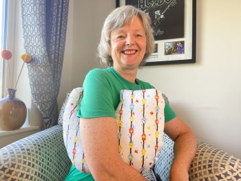 My breast cancer surgery recovery pillows are ideal for use directly after surgery, or in the following weeks while healing takes place. This support pillow is shaped to fit comfortably under the affected arm, and is filled with high quality polyester filling to a fairly firm finish, perfect to provide adequate support and comfort. This pillow reaches mid chest in width, so it will easily cover the surgery area, and provide support&nbsp; and padding.
It measures 43cm wide X 37cm long and 10 cm in depth. colourful bird houses on white print is soft and breathable. All pillows come with a handmade with love by Rodgerson Handcraft label and are reversible.