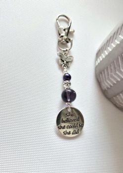 Looking for a personal treat or a meaningful gift for someone special?&nbsp; This beautiful handmade bag charm is just perfect! A gorgeous combination of silver and deep rich purple, with a cute butterfly charm and a lovely inspirational message.&nbsp;