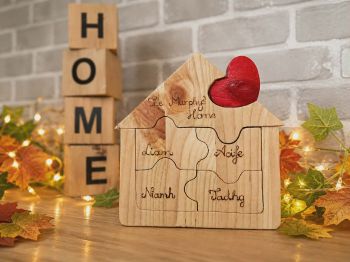 
A beautifully handcrafted, 7-piece wooden family house puzzle, custom-made in Ireland. 🏡❤️
Interlocking puzzle pieces personalized with your family names using traditional hand-burning (pyrography). Fully customizable for families of 2, 3, or 4 members, with custom greeting text on the roof and a hand-painted red heart at the center. 100% freestanding &ndash; perfect for your fireplace mantel or shelf.
⚠️ PLEASE NOTE / WARNING:This product is a decorative ornament, NOT a toy! Due to small interlocking parts, it is not suitable for young children and should be kept out of their reach.


&nbsp;
