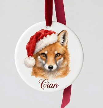 A beautiful festive bauble gift personalised with a choice of watercolour effect festive foxes,Printed on acrylic and finished in festive ribbon. A beautiful gift idea for the family and the Fox lover. &nbsp;Free postage