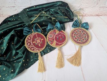 Short Description
A set of three hand-painted Christmas ornaments with decorative point-to-point details, ribbons and tassels.