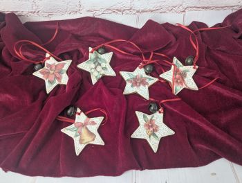 Handmade clay Christmas star ornament, approx. 8.5 cm, individually decorated with festive details and a small bell. Design supplied at random.