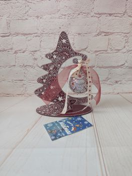 Hand-painted wooden Christmas tree decoration with a hanging ornament, presented in a gift box and organza bag.