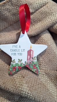 Being Irish, I believe this gift strikes a chord with many of us near and far. These are made using air drying clay and are hand stamped and sanded&nbsp; and decoupaged with a handpainted flame. For indoor use only. Approx 8 cm in size and come pre strung with ribbon. &nbsp;For me, it reminds me of my Nan who&rsquo;d always say a prayer and light a candle for all of us as her way of wishing us luck with any big events in our lives &ndash; be it exams, waiting to see if we got into college, getting married, etc. Nowadays many of us still light a candle to send blessings to those who have recently passed or loved ones who are sick and/or going through tough times. It&rsquo;s a beautiful tradition and a very special way of remembering those in our thoughts and/or prayers.