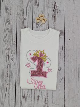 Personalised Princess tiara birthday t-shirts.
The tiara is embroidered with Metallic gold thread, the stars with Silver Metallic Thread, the numbers are applique on a short sleeve T-shirt with a special Iron on Vinyl.