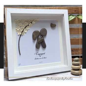 A lovely gift to congratulate them on their engagement, and a lovely memento to remind them of the happy day when they committed to each other. This piece features a couple embracing under a blooming tree. Underneath it reads &ldquo;Engaged&rdquo;, their names and date of engagement.