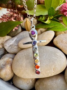 &nbsp;Ankh Cross Charka Necklace decorated with 7 Different Genuine&nbsp; gemstones&nbsp;
Material :Sterling SilverGem: Amethyst, Garnet, Iolite ,Blue Topaz, Peridot, Citrine, and CarnelianPendant Size: 43mm x 17mm