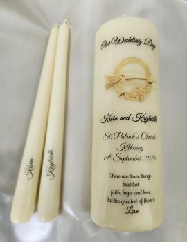 1 large ivory pillar candle and 2 taper candles