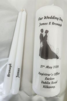1 large white pillar candle and 2 taper candles