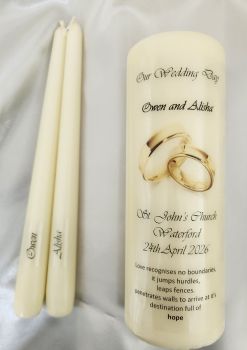 1 large ivory pillar candle and 2 taper candles