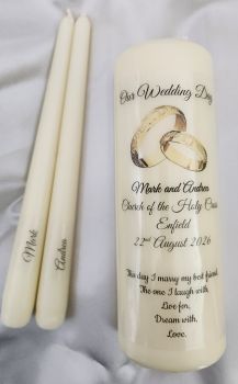 1 large ivory pillar candle and 2 taper candles