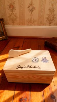 Personalised Hurling Medal box, with county and club crest with option for a favourite quote. Box is finished with a non toxic wax. The dimensions of the box are 29cm x 18cm x 13cm a very generous size to store all your well earned medals. The ideal gift for any hurling / camogie fanatic with a medal haul and nowhere to store them. Leave them speechless with this personalised medal keepsake box, something they will have to cherish their GAA medals. These personalised hurling or camogie medal keepsake boxes are the perfect gift for a birthday, mothers day, fathers day, communion, confirmation or Christmas present. A truly unique gift. &nbsp;
&nbsp;