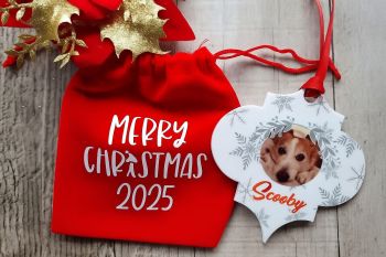A beautiful festive bauble gift personalised with with your favourite photo, printed on acrylic and finished in festive ribbon in a red velvet year stamped draw string pouch. A beautiful gift idea for the family and the animal lover.  
