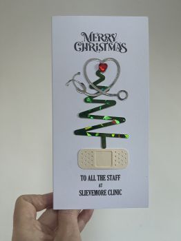 Christmas Appreciation Card for Healthcare Heroes
Show your gratitude to the dedicated and hardworking individuals in hospitals, practices, nursing homes, and beyond with this elegant card:

Heartfelt Design:&nbsp;Features a striking red gem heart detail, symbolizing care, compassion, and appreciation.
&nbsp;
Personalized Message:&nbsp;Can be customized with a thoughtful message to make it uniquely meaningful for the recipient.
Perfect for Healthcare Workers:&nbsp;A beautiful way to thank doctors, nurses, caregivers, and all those who work tirelessly during the year.
Keepsake Quality:&nbsp;More than just a card, it&rsquo;s a heartfelt gesture that will be treasured for its warmth and sincerity.

Let them know their efforts do not go unnoticed with this special Christmas card designed to honor their dedication and care. 🎄❤️✨