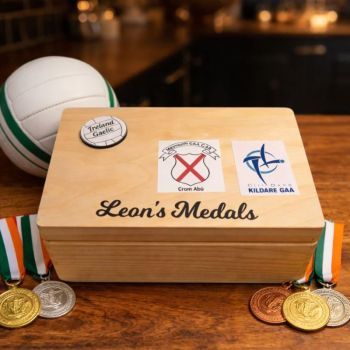 Personalised Gaelic Football, with county and club crest with option for a favourite quote. Box is finished with a non toxic wax. The dimensions of the box are 29cm x 18cm x 13cm a very generous size to store all your well earned medals. The ideal gift for any Gaelic Football fanatic with a medal haul and nowhere to store them. Leave them speechless with this personalised medal keepsake box, something they will have to cherish their GAA medals. These personalised Gaelic Football medal keepsake boxes are the perfect gift for a birthday, mothers day, fathers day, communion, confirmation or Christmas present. A truly unique gift. &nbsp;
&nbsp;