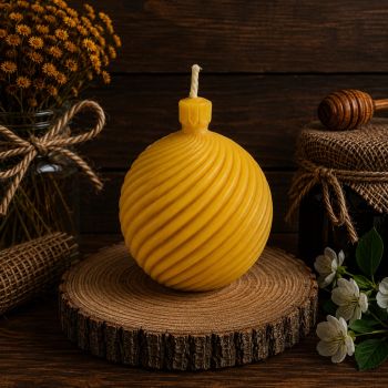 The Spiral Ball Beeswax Candle is a beautifully crafted candle made from 100% pure and natural beeswax produced by Donagh bees. It features a unique spiral design, creating a mesmerizing and captivating light display. This candle burns cleanly and evenly, emitting a natural honey scent that provides a warm and inviting atmosphere. The Spiral Ball Beeswax Candle is a perfect addition to any setting, whether as a decorative piece or for creating a cozy ambiance.
Width: 70mm

Height: 70mm
Weight: 118g
Burn time: 15 hour
