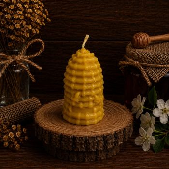 The Bee Hive Skep Beeswax Candle is a unique and eye-catching candle made from 100% pure and natural beeswax produced by Donagh bees. Its shape resembles a traditional bee skep, adding a touch of rustic charm to any setting. The candle burns cleanly and evenly, emitting a natural honey scent that provides a warm and inviting atmosphere. One of the benefits of using beeswax candles is that they emit negative ions when burned, which can help to purify the air and remove impurities, making for a healthier and fresher indoor environment.
Product Details:
Dimensions:&nbsp;7.62cm x 5.72cm
Materials:&nbsp;Pure Beeswax, Cotton
Weight 70g