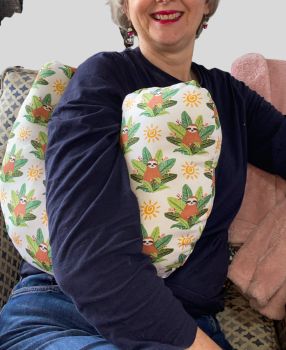 My breast cancer surgery support pillows are ideal for use directly after surgery, or in the following weeks while healing takes place. This support pillow is shaped to fit comfortably under the affected arm, and is filled with high quality polyester filling to a fairly firm finish, perfect to provide adequate support and comfort.&nbsp;
This pillow reaches mid chest in width, so it will easily cover the surgery area.It measures 43cm wide X 37cm long and 10 cm in depth. This smiling sloths in jungle leaves fabric which is soft and breathable. All pillows come with a I love handmade label, and are fully reversible. &nbsp;