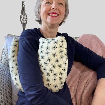 My breast cancer surgery support pillows are ideal for use directly after surgery, or in the following weeks while healing takes place. This support pillow is shaped to fit comfortably under the affected arm, and is filled with high quality polyester filling to a fairly firm finish, perfect to provide adequate support and comfort.&nbsp;
This pillow reaches mid chest in width, so it will easily cover the surgery area. It measures 43cm wide X 37cm long and 10 cm in depth. This has black vintage telephones on cream fabric and is soft and breathable. All pillows come with a I love handmade label and are fully reversible.