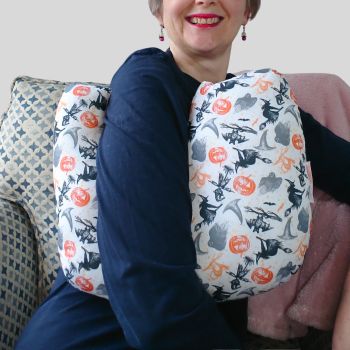 My breast cancer surgery support pillows are ideal for use directly after surgery, or in the following weeks while healing takes place. This support pillow is shaped to fit comfortably under the affected arm, and is filled with high quality polyester filling to a fairly firm finish, perfect to provide adequate support and comfort.&nbsp;
This pillow reaches mid chest in width, so it will easily cover the surgery area. It measures 43cm wide X 37cm long and 10 cm in depth. This has Halloween witches, pumpkins and ghosts print fabric and is soft and breathable. All pillows come with a made with love by Rodgerson Handcraft label and are reversible.