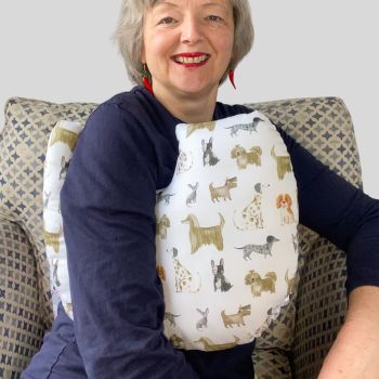 My breast cancer surgery support pillows are ideal for use directly after surgery, or in the following weeks while healing takes place. This support pillow is shaped to fit comfortably under the affected arm, and is filled with high quality polyester filling to a fairly firm finish, perfect to provide adequate support and comfort.
This pillow reaches mid chest in width, so it will easily cover the surgery area, and provide support&nbsp; and padding. It measures 43cm wide X 37cm long and 10 cm in depth. This has lots of diffierent dogs digital print fabric and is soft and breathable. All pillows come with a made with love by Rodgerson Handcraft label and are reversible.