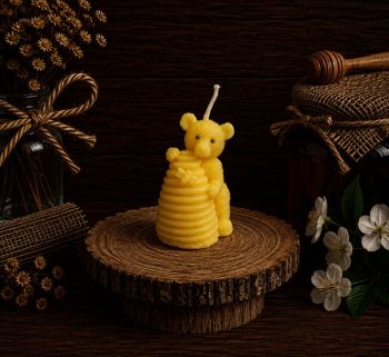 Introducing our Bear with Beehive Beeswax Candle, a delightful creation crafted from our own pure beeswax. Standing at 70mm in height, 50mm in width, and weighing 35g, this whimsical candle adds a touch of nature to your decor. While the burn time is not specified in your request, you can fill in the burn time based on your product specifications. Whether you&rsquo;re a nature enthusiast or seeking a unique gift, the Bear with Beehive Beeswax Candle combines artistry and sustainability for a charming addition to any space