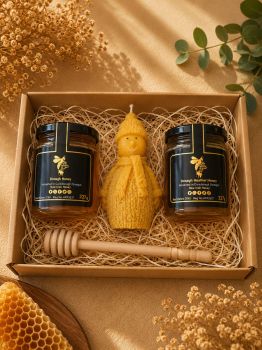 Unwrap the joy of nature with our Gift Box, featuring a jar of Heather Honey, a jar of Summer Honey, and a handcrafted Snowman Beeswax Candle. A delightful trio for any occasion, bringing sweetness and warmth to your celebrations.