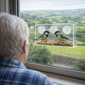 A large clear bird feeder that sticks to the outside of your window. We get robins, sparrows &amp; tits eating from our&nbsp;Window Bird Feeder&nbsp;in Ireland. Easy Clean with a removable tray. Drainage holes to keep seeds dry and ventilated.
