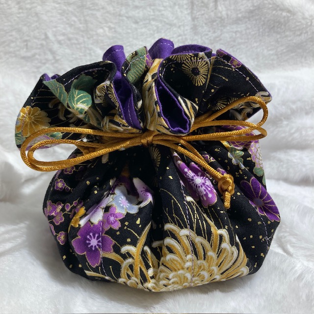 Each Jewellery Pouch is handmade from beautiful 100% cotton fabric. It is fully lined and has a drawstring closure. There are 8 small pockets inside plus a main compartment to put larger pieces of jewellery. They are pumpkin shape and measure approximately 14cm. (5.5 inches) in diameter when closed and 25cm (10 inches) when open.
These cute little pouches are perfect for carrying your jewellery when you’re travelling or even to store a few special pieces in your drawer at home. There are a variety of colours and designs to choose from. One to suit every taste.
If you wish to send this Jewellery Pouch to someone special you can add a personal note (in the “Note to vendor” option), which we will handwrite and enclose with your order. Just put their name and address in the shipping information and we’ll post it for you…. as easy as that!