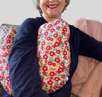 Just so you know this is not a medical device or aid
My breast cancer surgery support pillows are ideal for use directly after surgery, or in the following weeks while healing takes place. This support pillow is shaped to fit comfortably under the affected arm, and is filled with high quality polyester filling to a fairly firm finish, perfect to provide adequate support and comfort.&nbsp;
This pillow reaches mid chest in width, so it will easily cover the surgery area. It measures 43cm wide X 37cm long and 10 cm in depth. This print fabric and is soft and breathable. All cushions come with a made with love by Rodgerson Handcraft label and are reversible.
You can opt for matching side ties which can be used to secure the pillow in place, if desired.