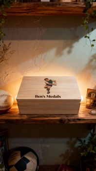 Personalised Rugby Medal box, with provence and club crest.&nbsp; Choose male or female player, hair colour and kit colour. Box is finished with a non toxic wax. The dimensions of the box are 29cm x 18cm x 13cm a very generous size to store all your well earned medals. The ideal gift for any rugby fanatic with a medal haul and nowhere to store them. Leave them speechless with this personalised medal keepsake box, something they will have to cherish their rugby medals. These personalised rugby medal keepsake boxes are the perfect gift for a birthday, mothers day, fathers day, communion, confirmation or Christmas present. A truly unique gift. &nbsp;