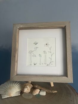 Family.&nbsp; Made from geniune tumbled seaglass collected by me and my family from Seaham beach.&nbsp; &nbsp;Wooden frame 9 inches X 9 Inches.&nbsp;