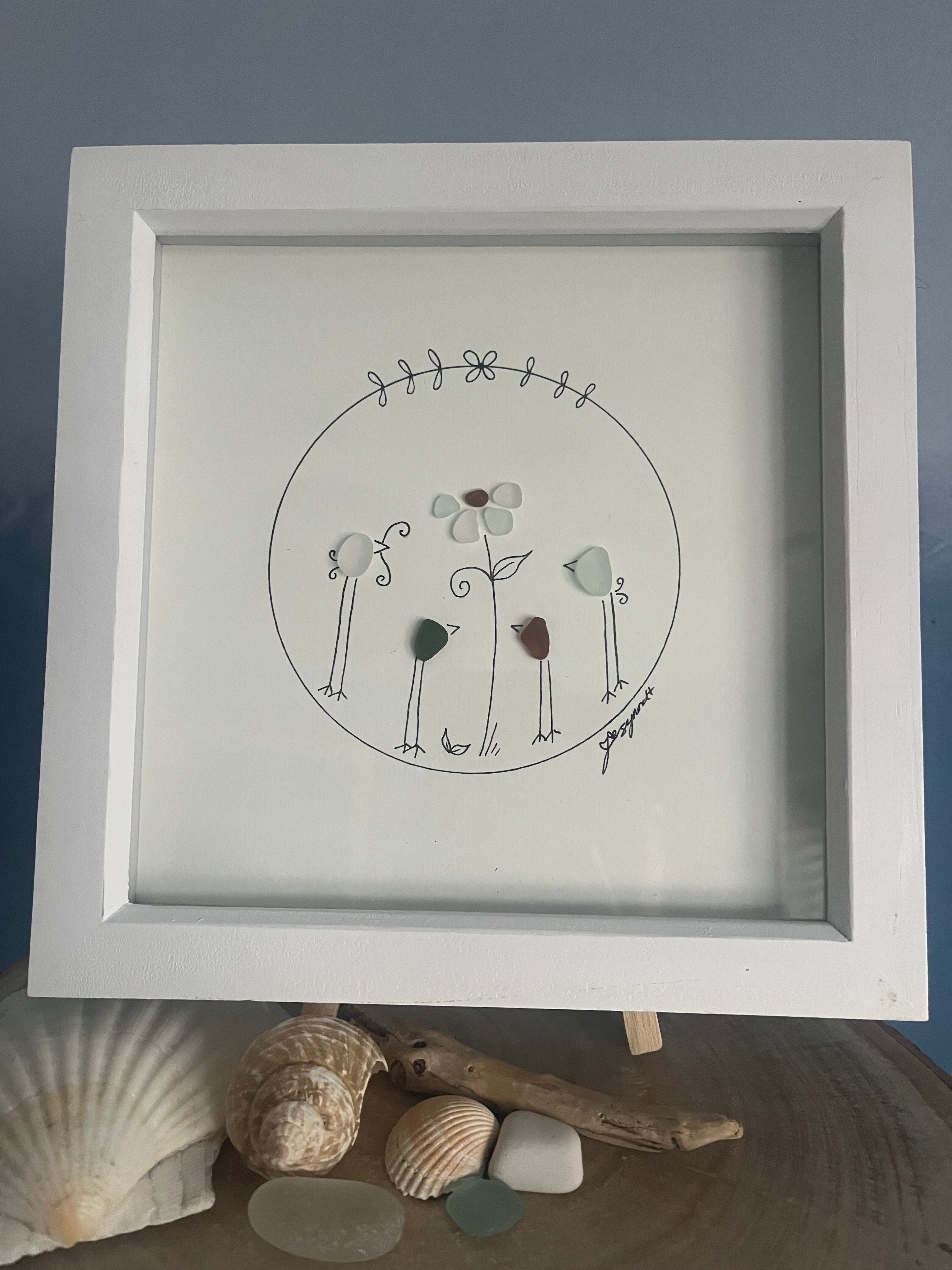 Family together time.&nbsp; Made from geniune tumbled seaglass collected by me and my family from Seaham beach.&nbsp; &nbsp;White frame 9 inches X 9 Inches.&nbsp;