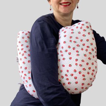 My breast cancer surgery support pillows are ideal for use directly after surgery, or in the following weeks while healing takes place. * This support cushion is shaped to fit comfortably under the affected arm, and is filled with quality polyester filling to a fairly firm finish, perfect to provide adequate support and comfort. * This pillow reaches mid chest in width, so it will easily cover the surgery area, and provide support&nbsp; and padding.
It measures 43cm wide X 37cm long and 10 cm in depth. This strawberries on white fabric is soft and breathable. All pillows come with a made with love by Rodgerson Handcraft label and are reversible.