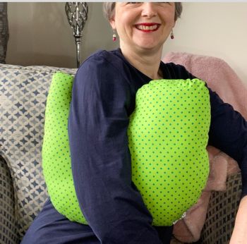 This breast cancer surgery support pillow is ideal for use directly after surgery, or in the following weeks while healing takes place. * This support pillow is shaped to fit comfortably under the affected arm, and is filled with quality polyester filling to a firm finish, provide adequate support and comfort
I am a breast cancer survivor myself so I understand what is needed after having had chest surgery, and how important comfort and support is when you're healing.&nbsp;
It measures 43cm wide X 37cm long and 10 cm in depth. This lime green and navy polka dots cotton fabric is soft and breathable. All cushions come with a made with love by Rodgerson Handcraft label and are reversible.