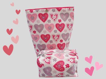 This sanitary pads holder bag has bright big hearts print on white or grey background print. This medium sized period pads holder is ideal for first periods for your teenage girl. It is fully lined with matching cerise pink cotton fabric. It has a 3 press studs to close.&nbsp;
This bag will fit standard period pads or tampons packets. The bag measures 24cm long X 18cm wide with a handmade tag added. It is a descreet way of holding pads, if needed or can&nbsp; be used for everyday uses.&nbsp;&nbsp;