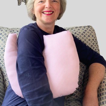 This breast cancer surgery support pillow is ideal for use directly after surgery, or in the following weeks while healing takes place. * This support pillow is shaped to fit comfortably under the affected arm, and is filled with quality polyester filling to a firm finish, provide adequate support and comfort
I am a breast cancer survivor myself so I understand what is needed after having had chest surgery, and how important comfort and support is when you're healing.
It measures 43cm wide X 37cm long and 10 cm in depth. This pink and white candy striped cotton fabric is soft and breathable. All cushions come with a made with love by Rodgerson Handcraft label and are reversible.