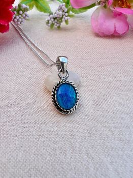 Oval Natural Blue Australian Doublet Opal Sterling&nbsp;Silver Necklace
Metal: Sterling Silver
Gem:&nbsp; Natural Australian Doublet Opal
Opal Size: 10mm x 8mm