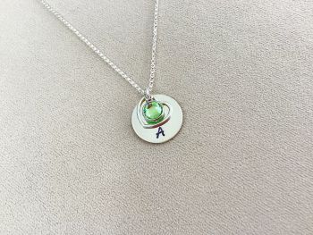 August birthday girl personalised initial and August peridot birthstone necklace with silver heart charm. Meaningful and elegant gift customised for you.