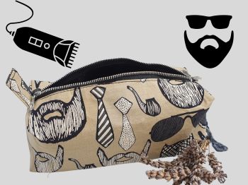 This men's toiletry fabric bag has beards, moustaches, ties and dark sun glasses print fabric. This is a squared, medium sized pouch, lined with coordinating black fabric, black metal zip and hand shaped handmade tag.&nbsp;
This bag will fit the standard hair electric clippers razor. The bag measures 19cm long X 7cm X 10cm wide. It's will&nbsp; hold both clippers and associated blade covers.&nbsp;