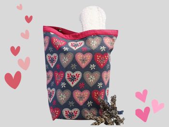 This set of two fabric pouches set has bright big pink hearts print on grey print. These two pouches,onemedium and one small, is ideal for first periods for your teenage girl. It is fully lined with matching cerise pink cotton fabric. It medium sized pouch has a 3 press studs to close, and the small one has a white zip to close.&nbsp;
This medium pouch will fit standard period pads or tampons packets, the small bag will fit a few tampons or small pads. The medium pouch measures 24cm long X 18cm wide with a handmade tag added. The small pouch measures 13cm X 9cm X 2cm. It's approximately the size of a standard packet of cards.
It is a descreet way of holding pads, if needed or can&nbsp; be used for everyday uses.&nbsp;&nbsp;