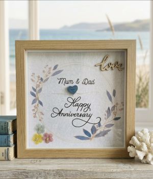 Printed wedding anniversary with wooden embellishments.