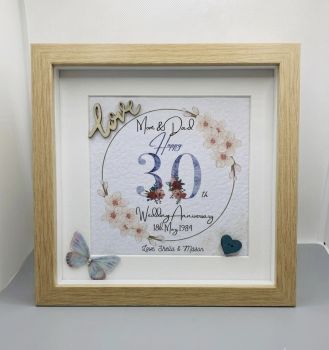 Printed wedding anniversary with wooden embellishments.
