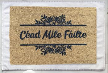 Céad Míle Fáilte meaning “100,000 welcomes” is part of our As Gaeilge doormat range. 
Add some of the beautiful Gaeilge language to your home, it’s the perfect way to greet you or your guests every day! Our doormats also make wonderful gifts for Housewarmings, Weddings, Birthdays, Christmas or "just because".
All of our products are hand-painted and made to order with love just for you.
Go Raibh Maith Agat!