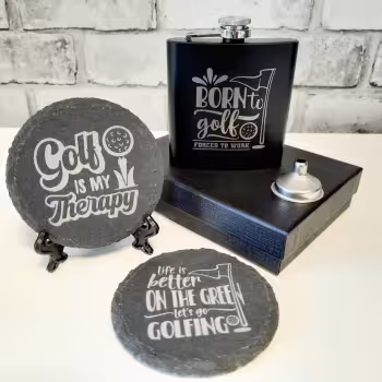 This personalised golf gift box would make a wonderful gift idea for the golf fanatic in your life. Its the ideal gift for anyone who is a fan of golf and enjoys nothing more than a few hours out on the course.
Personalised Gift For Golfers
This wonderful gift box includes a laser engraved black hip flask which can include a name engraved under the graphic itself and 2 engraved golf themed round slate coasters, each with a display stand included.
This wonderful little set comes presented in a stylish black gift box making it ‘Ready To Gift’. It’s a unique and fun yet practical little gift that is sure to bring a smile to their face.
Golf Gift Box Includes:
1 x 6oz Golf themed hip flask (with optional engraved name)
2 x Golf themed round engraved slate coasters with display stands